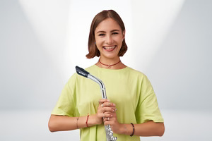 Girl holding a flute with a Fliphead attached