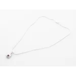 Image links to product page for Ellen Burr Sterling Silver Tiny Trill Key Necklace With Rhodolite 